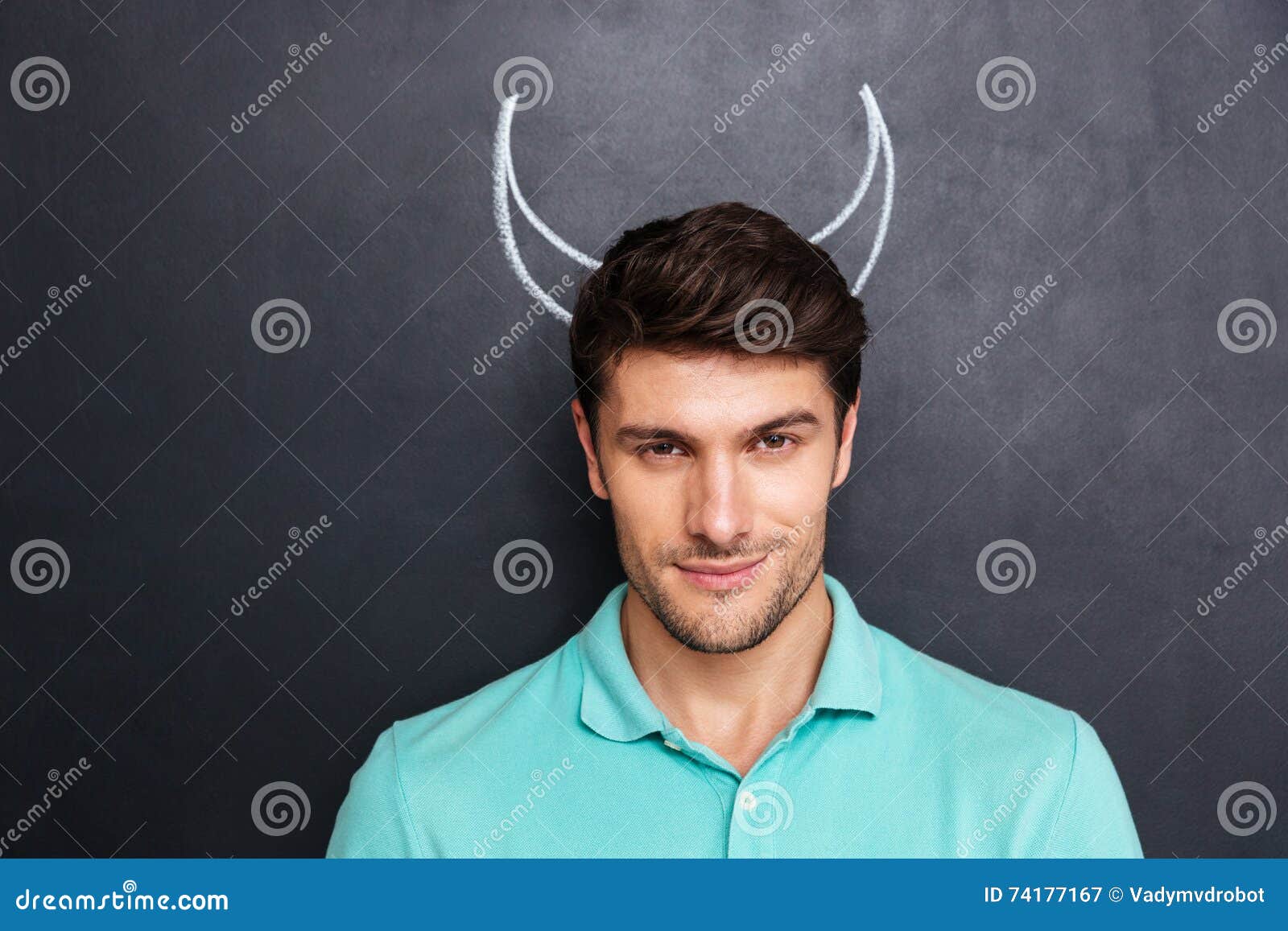 Closeup of Handsome Young Man with Drawn Devil Horns Stock Image