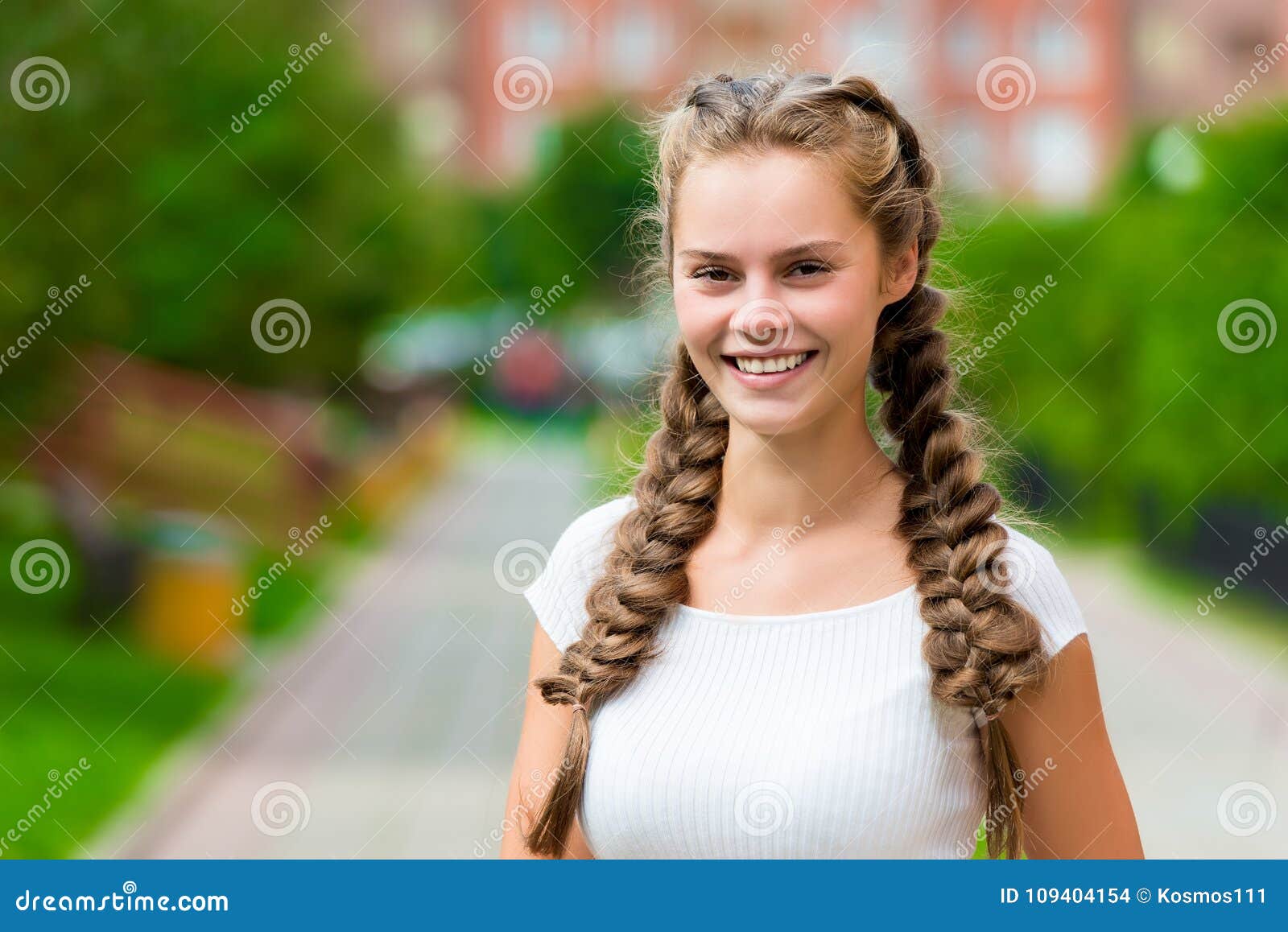 Closeup Happy St 20 Year old Woman  In A White T shirt 