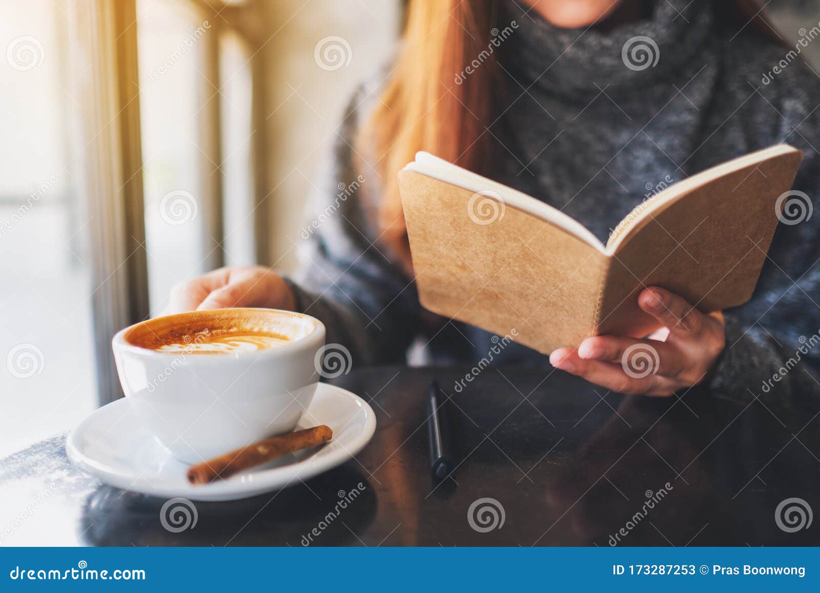 A Beautiful Woman Reading A Book While Drinking Coffee In The Morning Stock Image Image Of