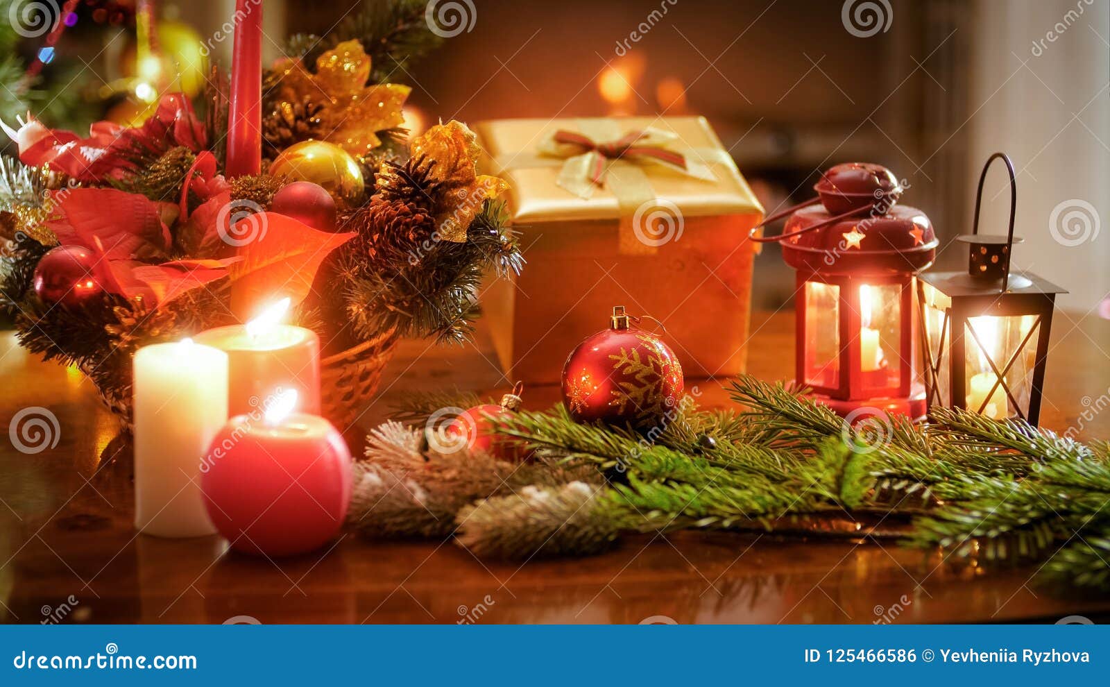 Closeup Image of Candles on Lanterns Next Christmas Gifts and Wreath ...