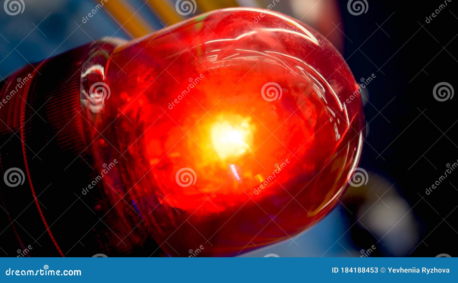 Closeup Image of Glowing Red Fire Alarm Light Installed in Modern