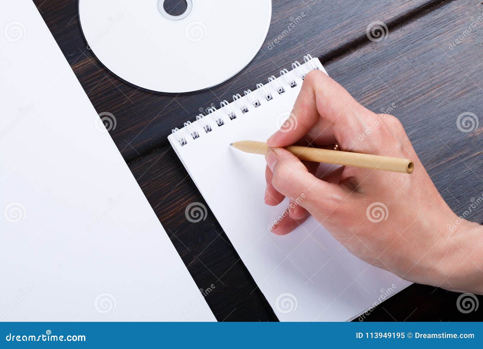 Hand is Writing on a White List of Paper with a Pen Composition. Mock ...