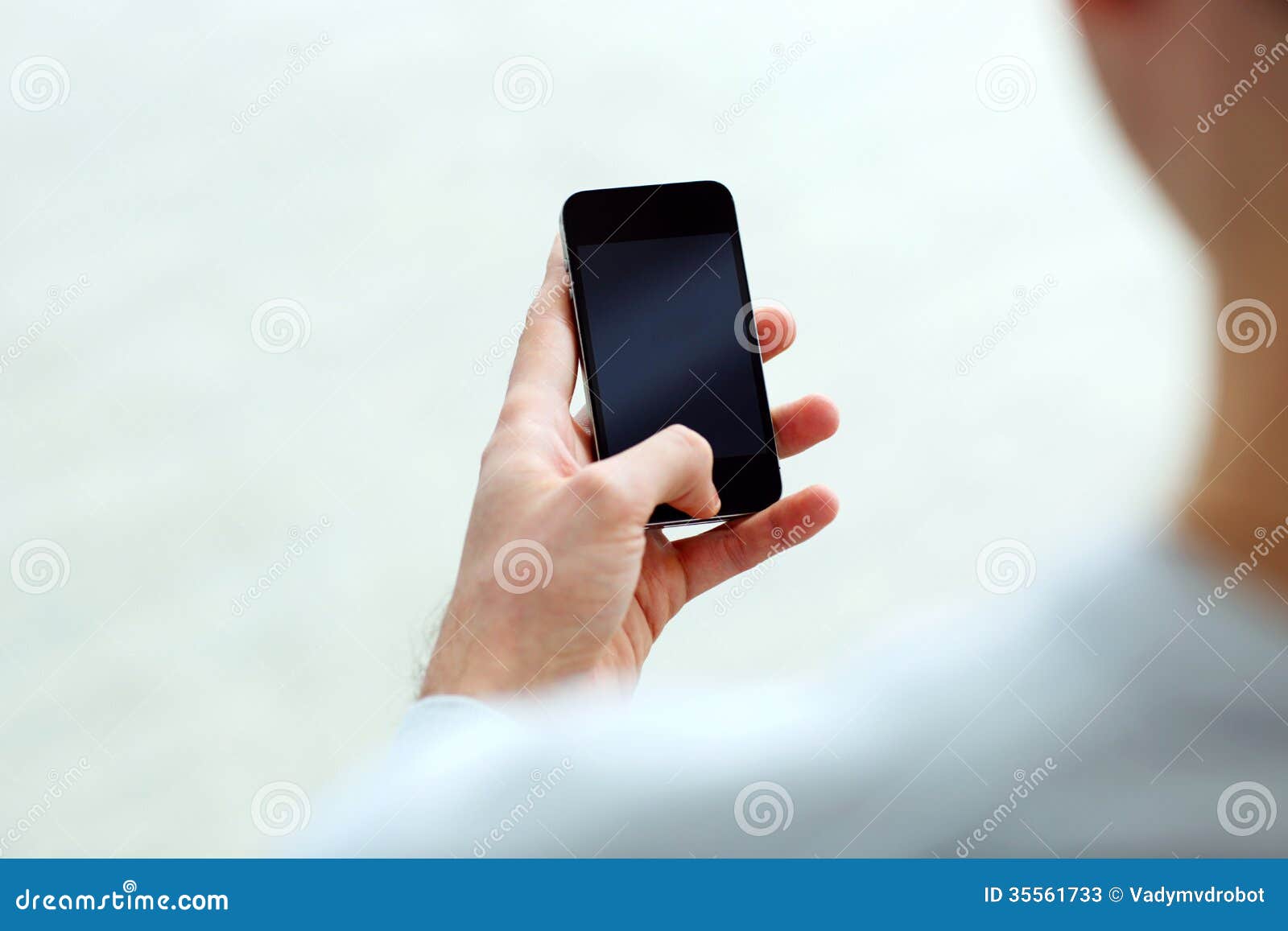 Closeup Image of a Man Holding Smartphone and Looking at Display Stock ...