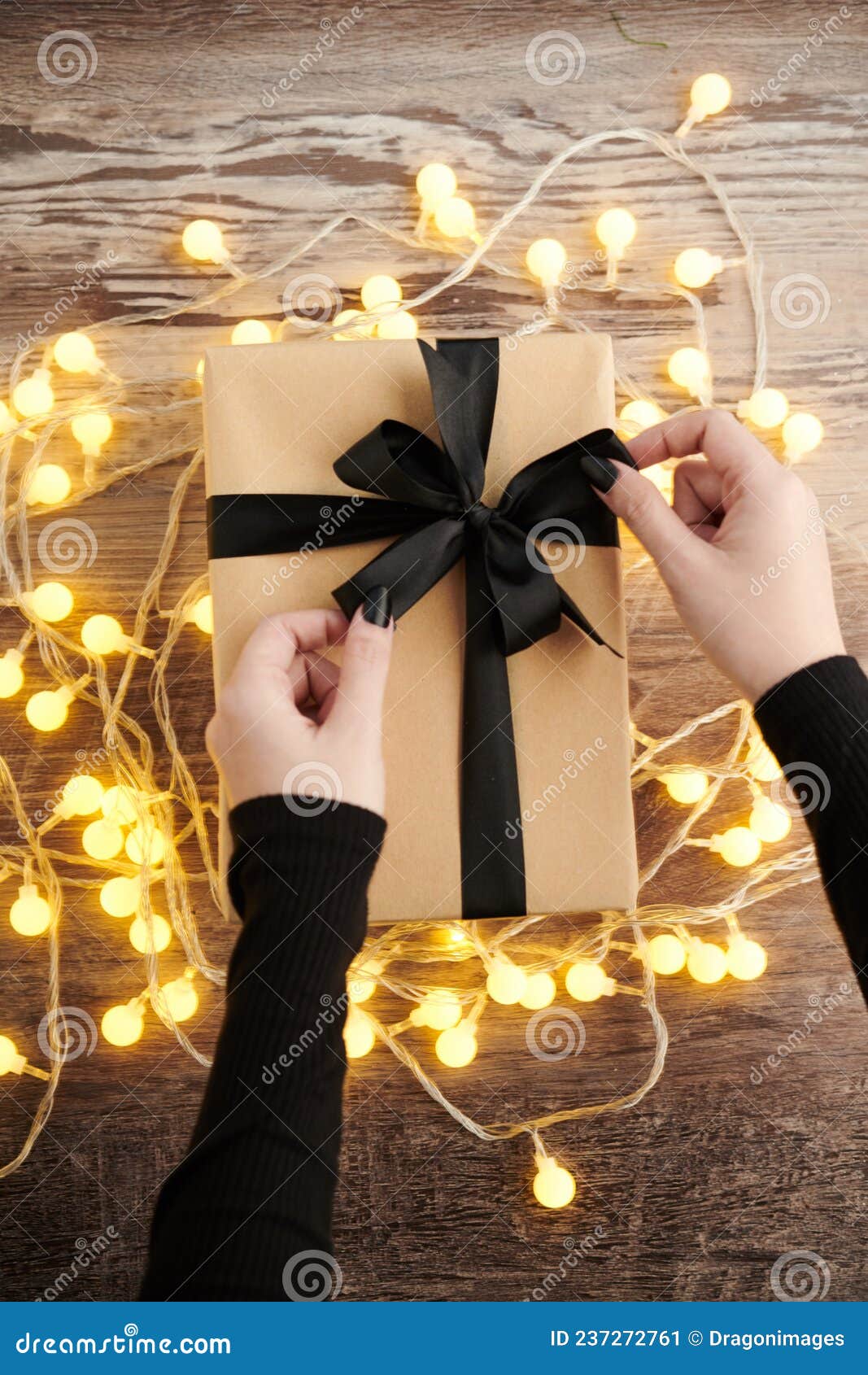 Woman Tying Bow on Christmas Present Stock Image Image of packaging