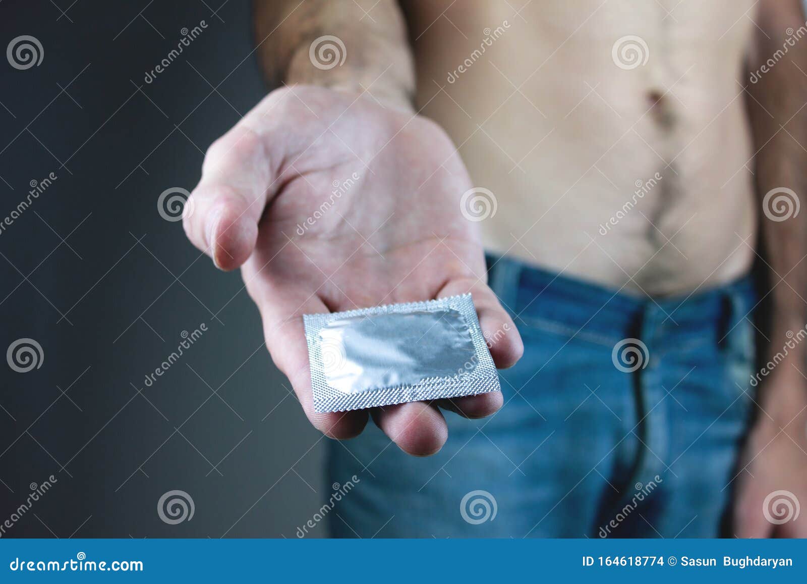 Closeup Image of a Young Man with a Condom Stock Photo Image of hand