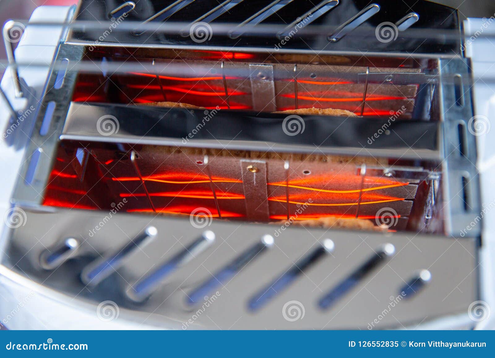 closeup inside bread toaster heating 