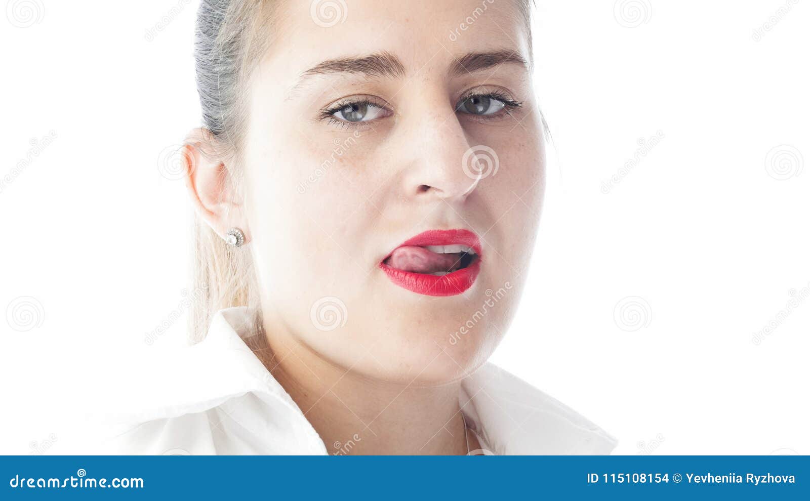 Closeup Isolated Portrait Of Young Woman With Red Lipstick Licking Her