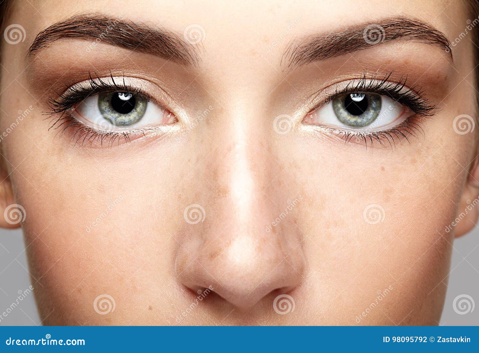 closeup macro portrait of female face. human woman open eyes wit