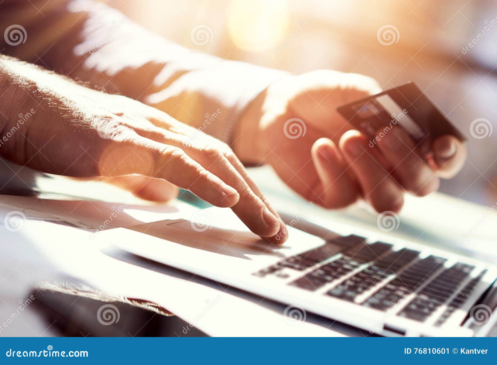 closeup man holding hand credit card.businessman use laptop online payments shopping.guy typing keyboard notebook name