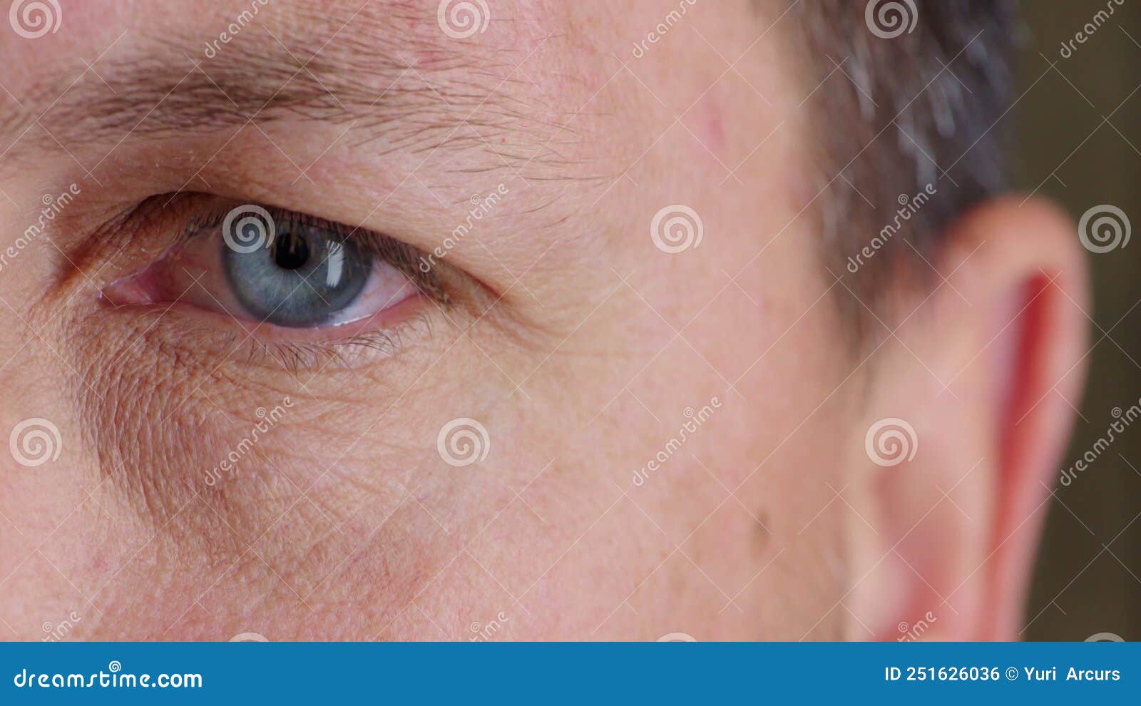 Closeup of a Man Testing His Vision and Eyesight at the Optometrist