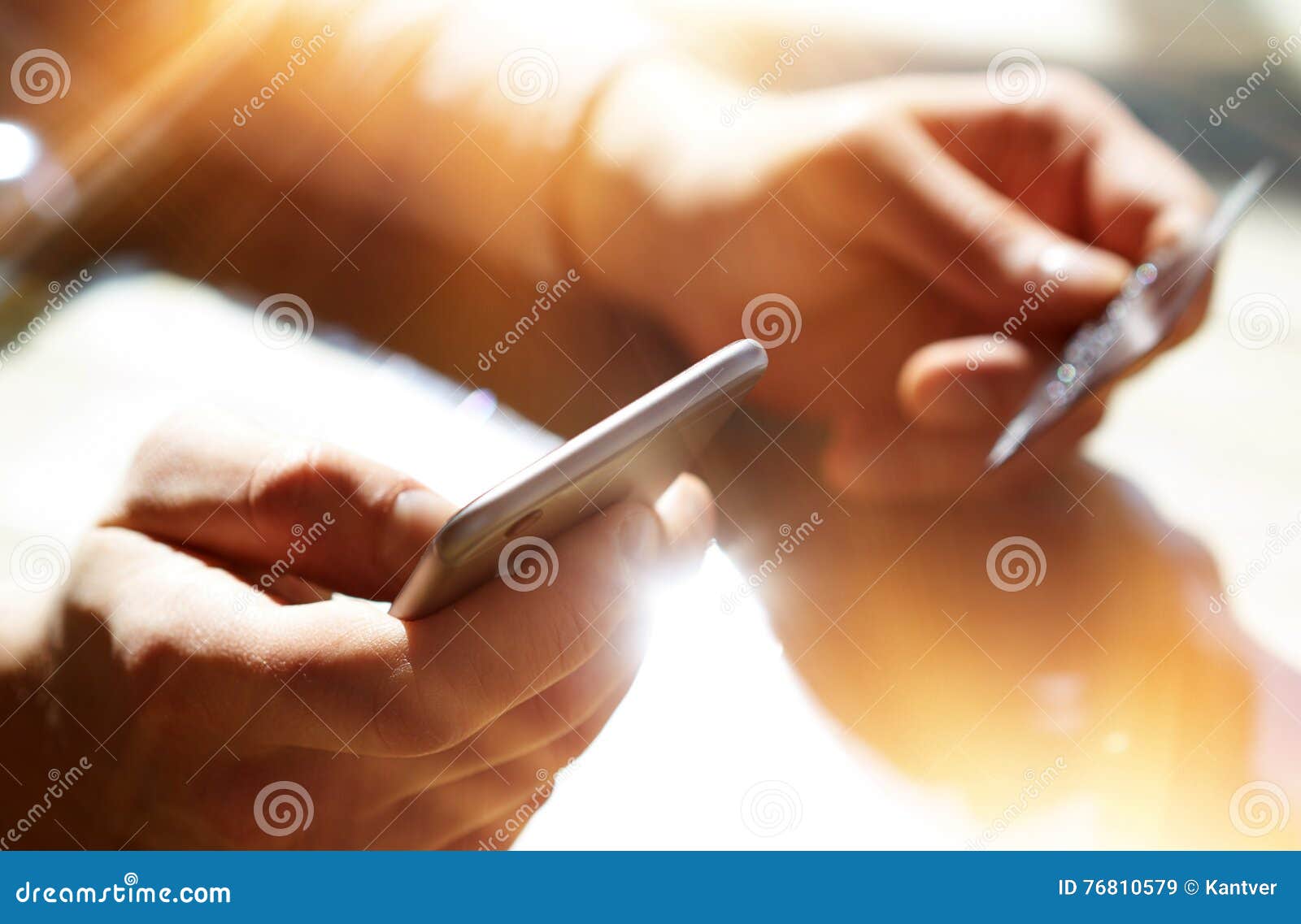 closeup men holding hand credit card.businessman use smartphone online payments shopping.guy touching screen mobile