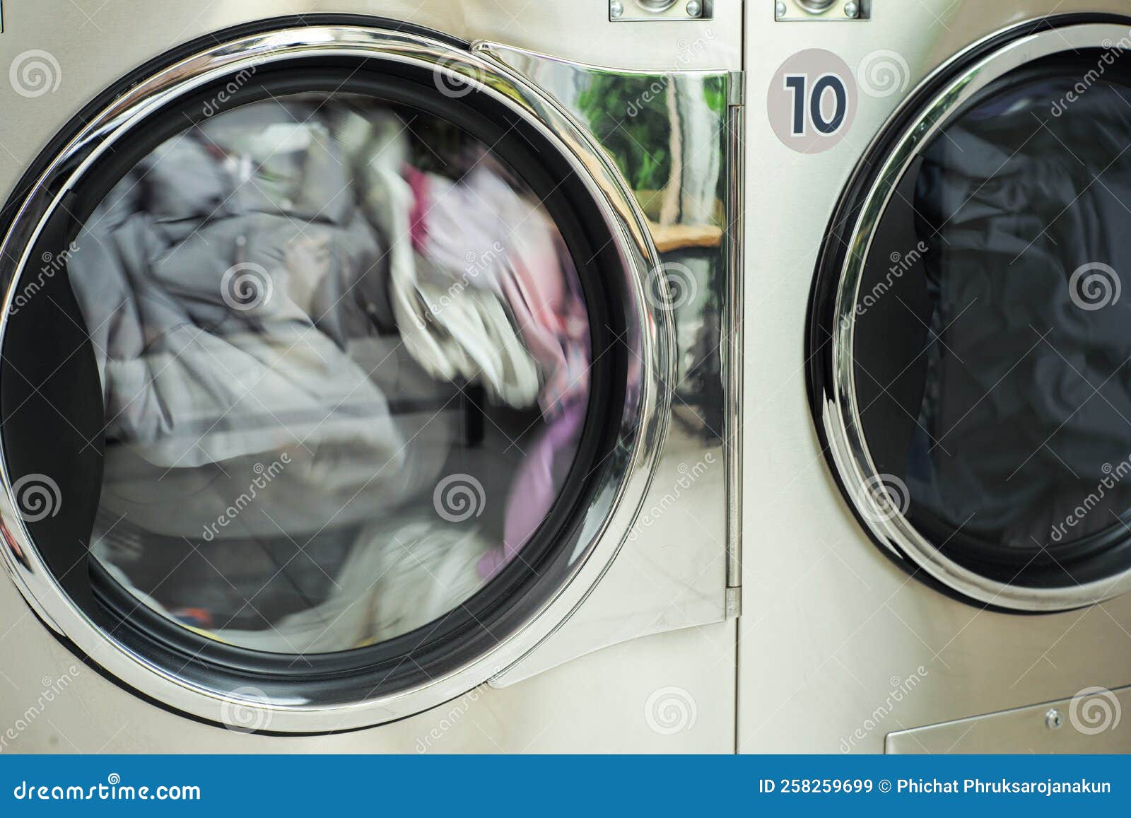 Closeup Motion Blurred of the Clothes Spinning Inside the Dry Machine