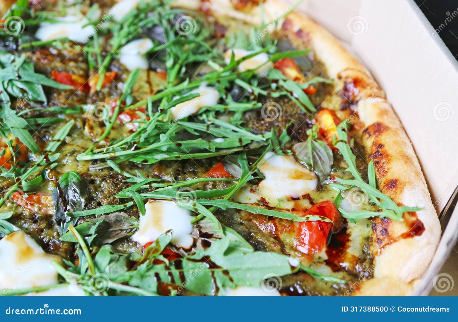 mouthwatering margherita pizza topped with arugula and balsamic