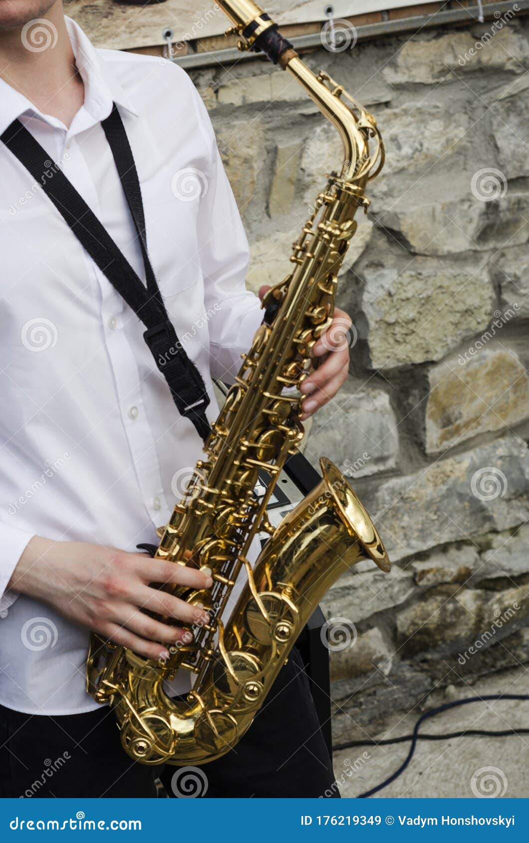 Closeup of a Musical Saxophone Held in Hands Stock Image Image of