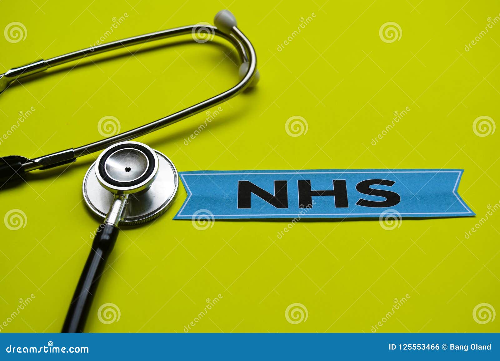 closeup nhs with stethoscope concept inspiration on yellow background