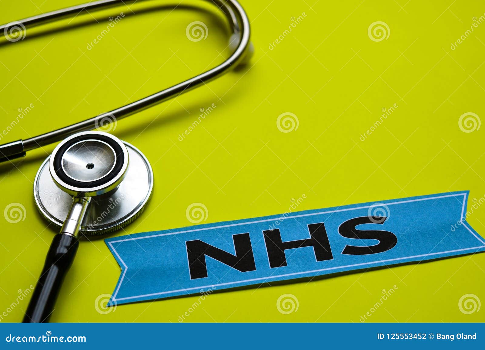 closeup nhs with stethoscope concept inspiration on yellow background