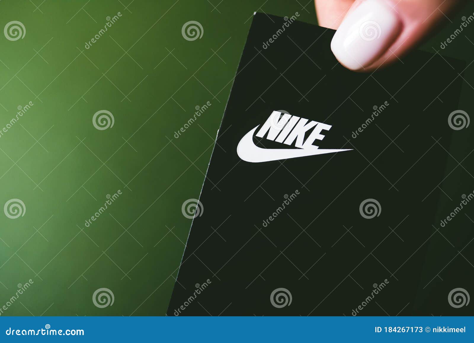 Closeup of Nike Logo Label on Green Background. Editorial Stock ...