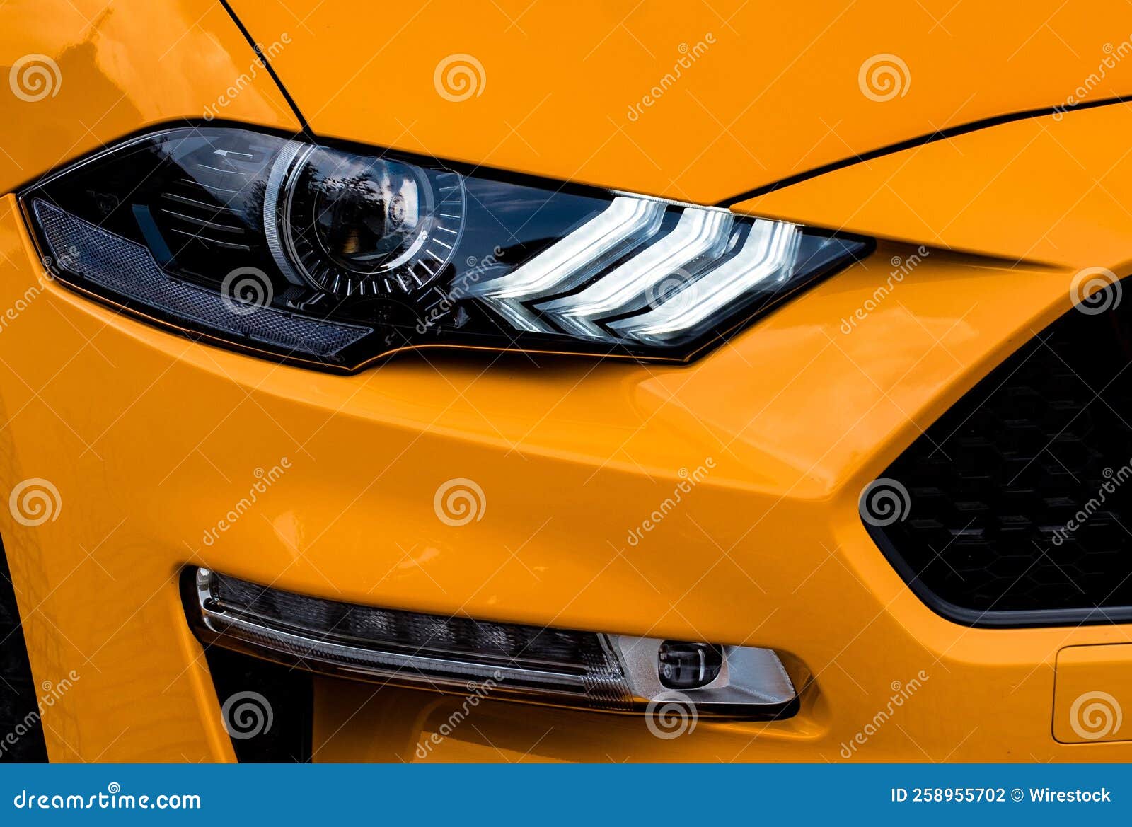 Closeup of an Orange Car S Headlight. Stock Photo Image of design