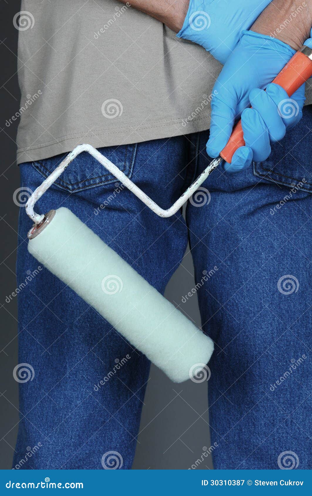 Painter Seen from Behind Holding Paint Roller Stock Image Image of