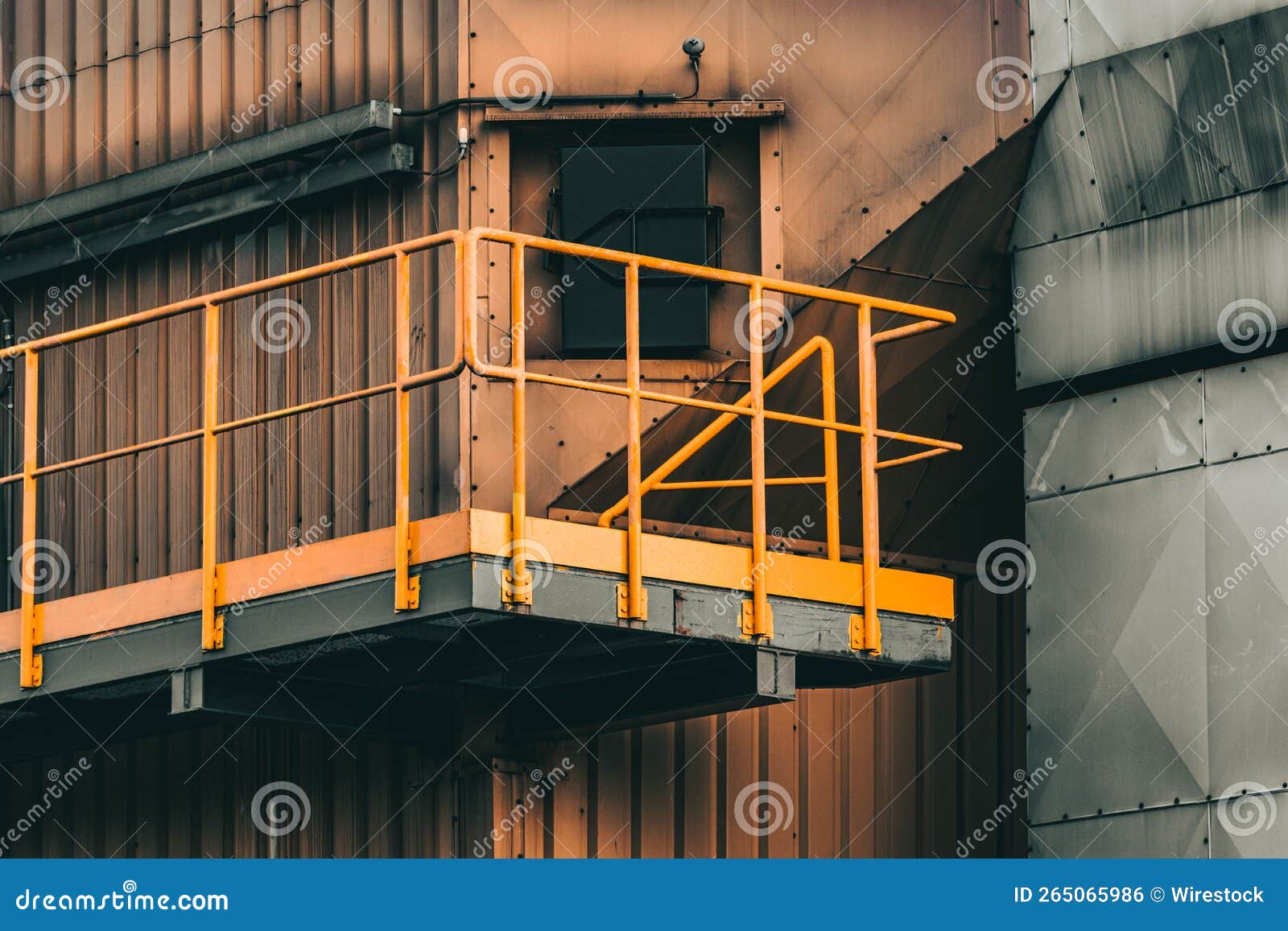 Closeup of the Part of a Structure with Orange and Gray Walls and a