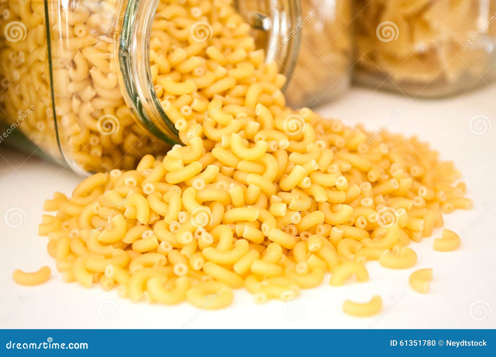 Closeup of Pasta Falling from Glass Container Stock Photo Image of