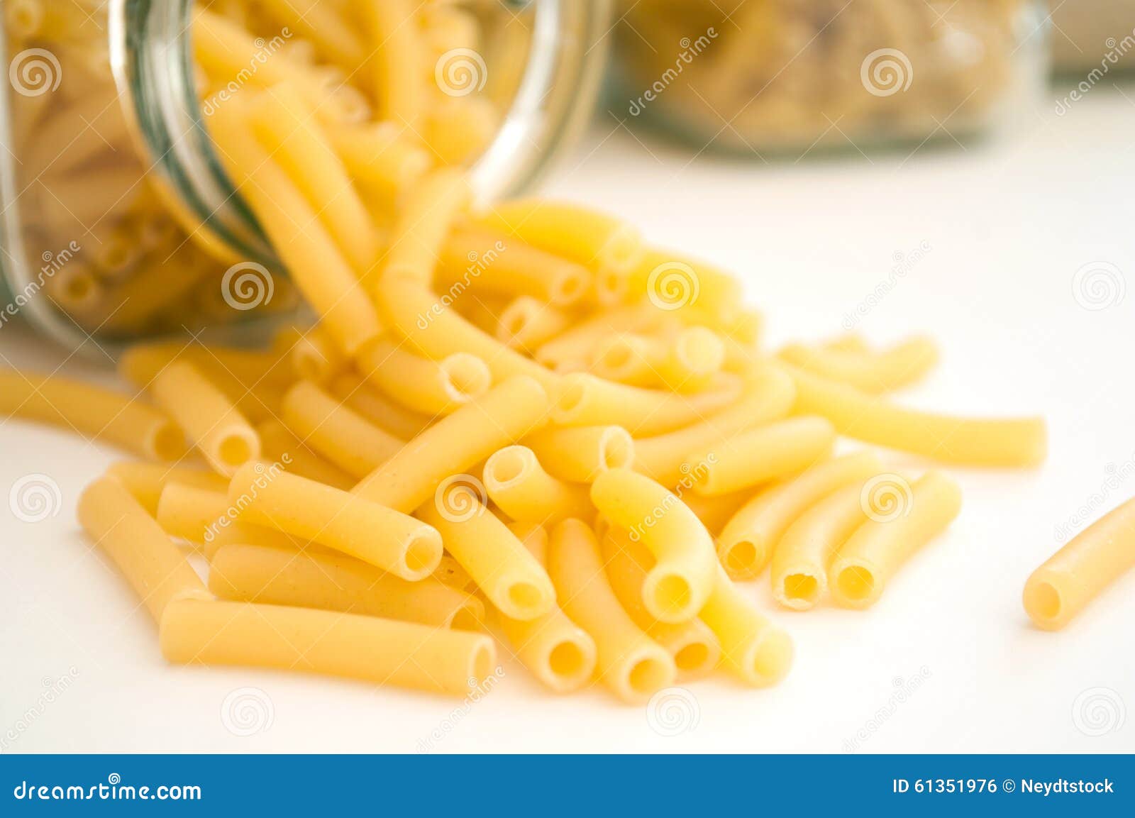 Closeup of Pasta Falling from Glass Container Stock Photo Image of