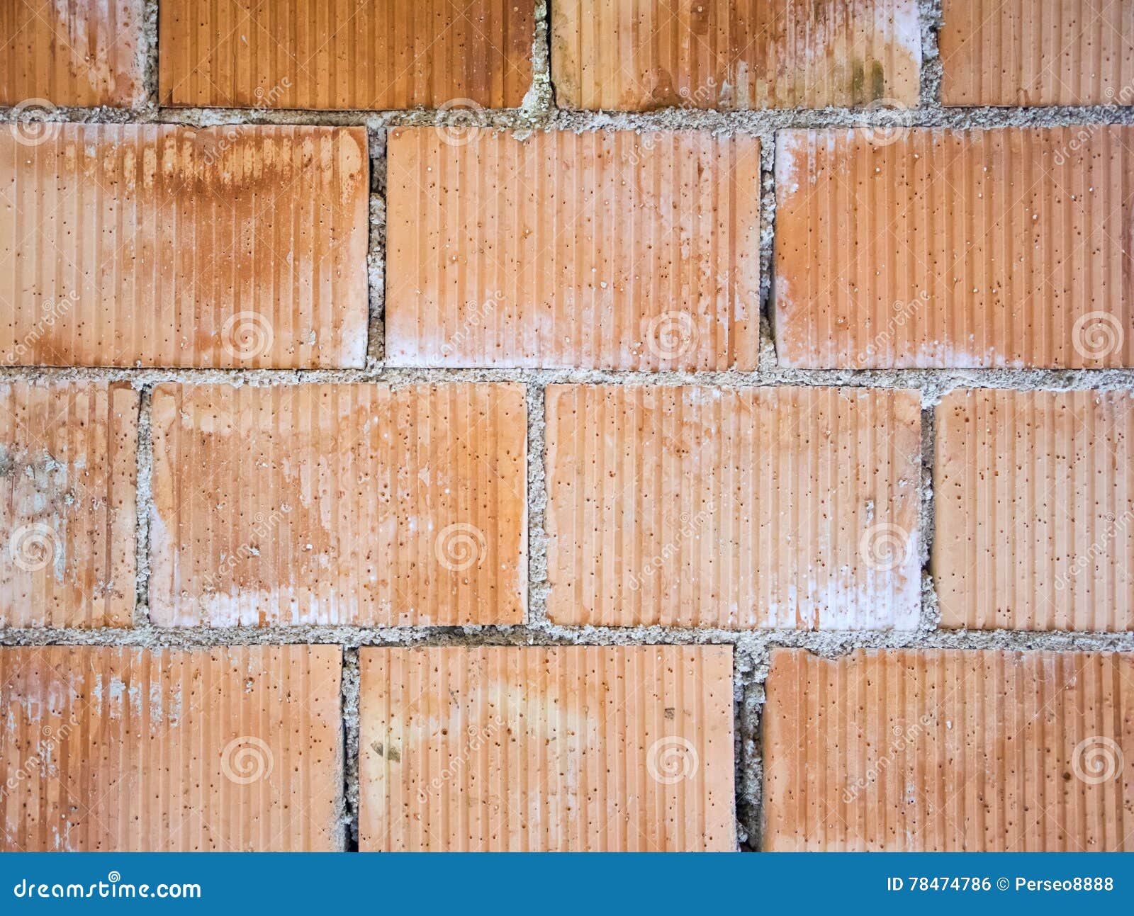 Closeup of perforated clay blocks wall.