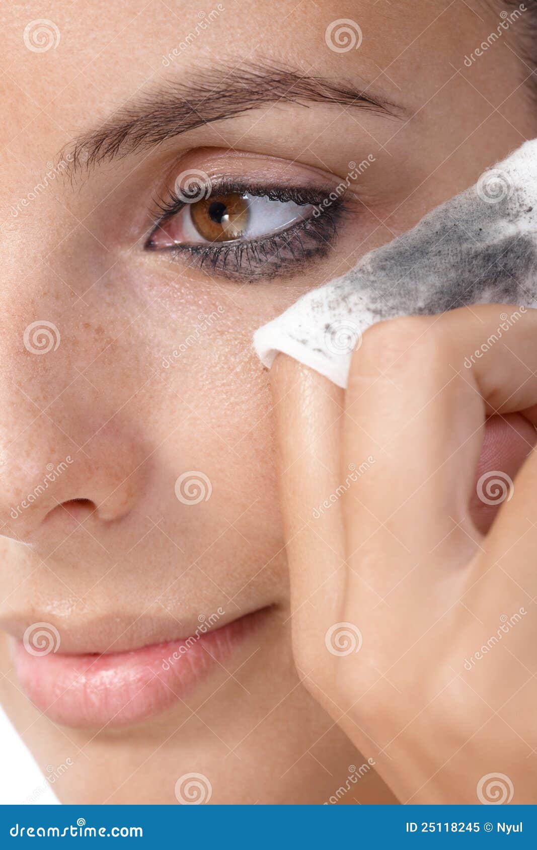 closeup photo of removing eye makeup