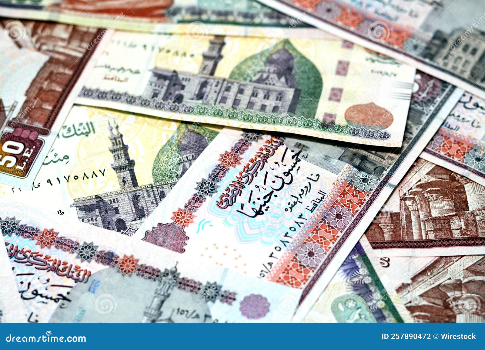 Pile Of Egyptian And American Money Currency Banknotes Of 1 2 And 20 pile-of-egyptian-and-american-money-currency-banknotes-of-1-2-and-20