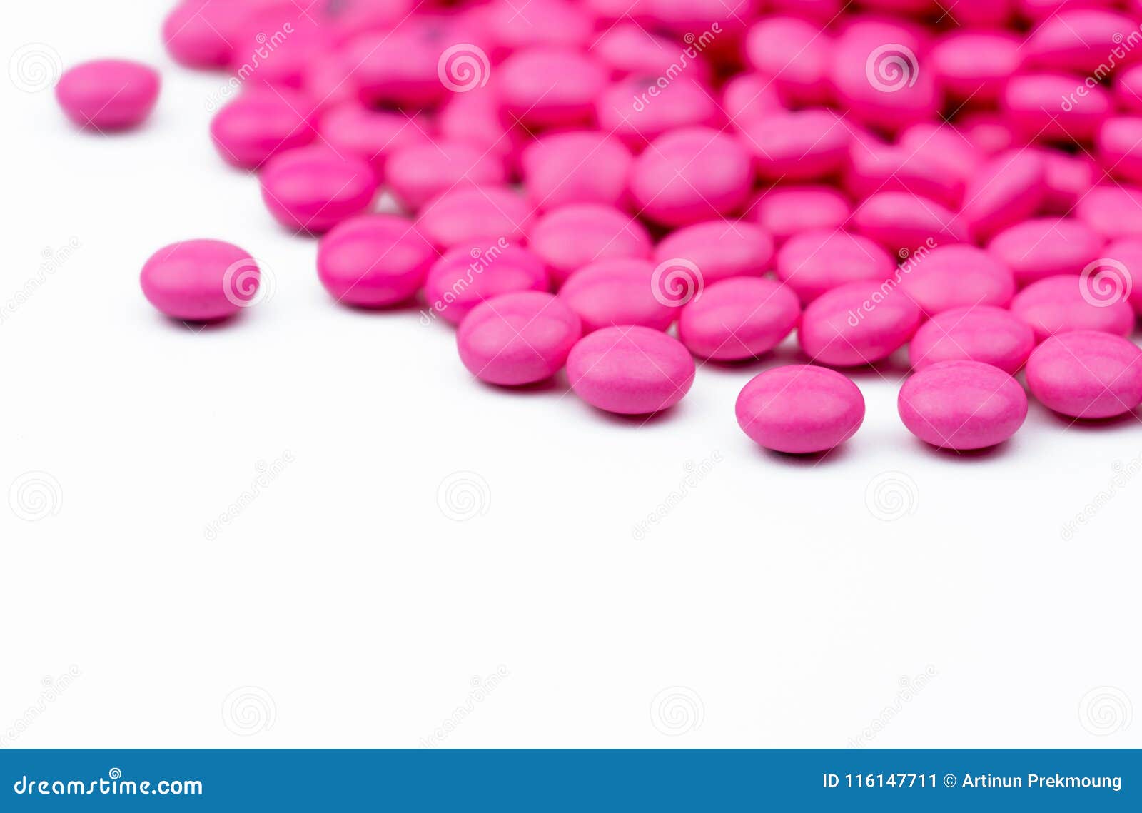 closeup pile of pink round sugar coated tablets pills  on white background with copy space. amitriptyline medicine