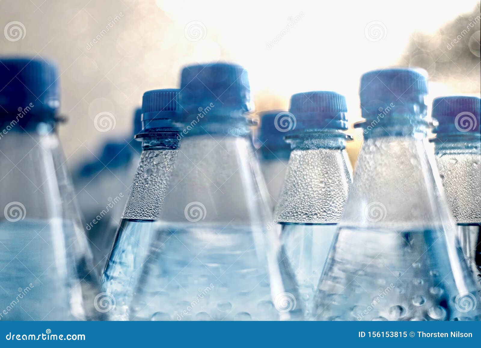 Closeup on Plastic Water Bottles in Raw and Lines. Stock Image Image