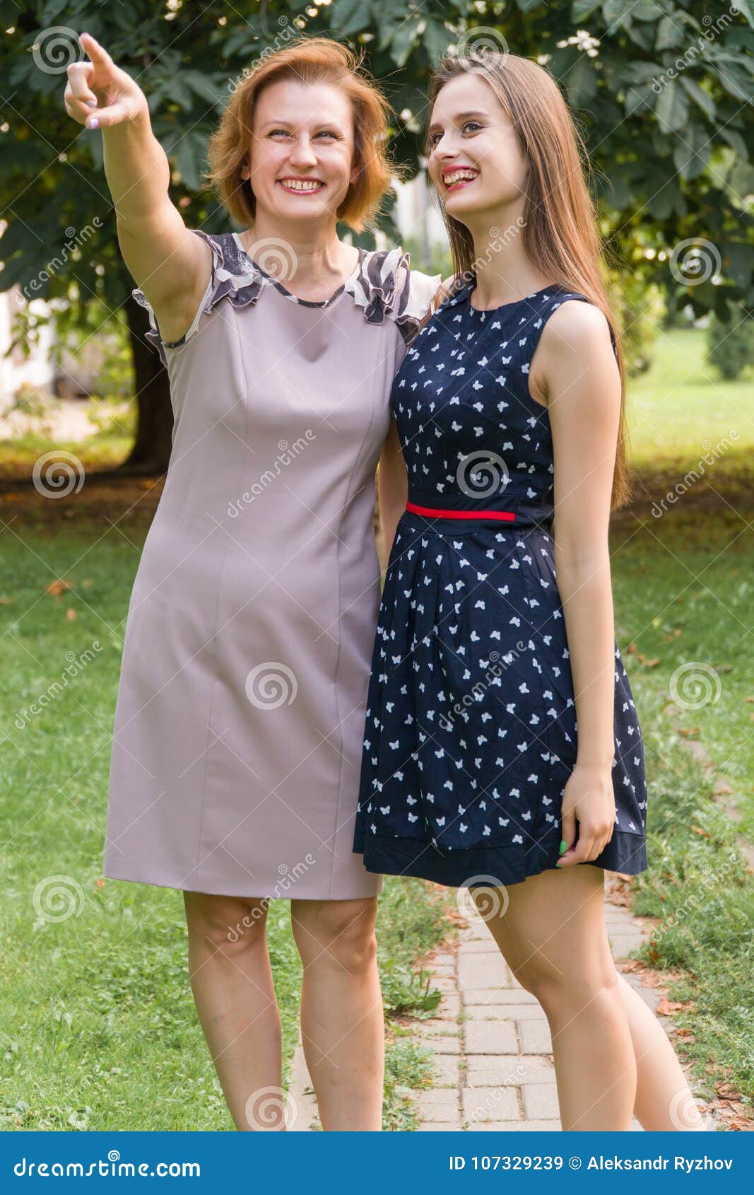 Closeup Portrait Of Adult Daughter And Mother Outdoors Pretty Brunette