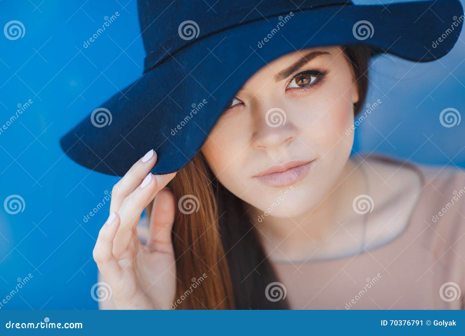 Closeup Portrait of a Beautiful Young Woman with Hat Outdoor Looking at ...