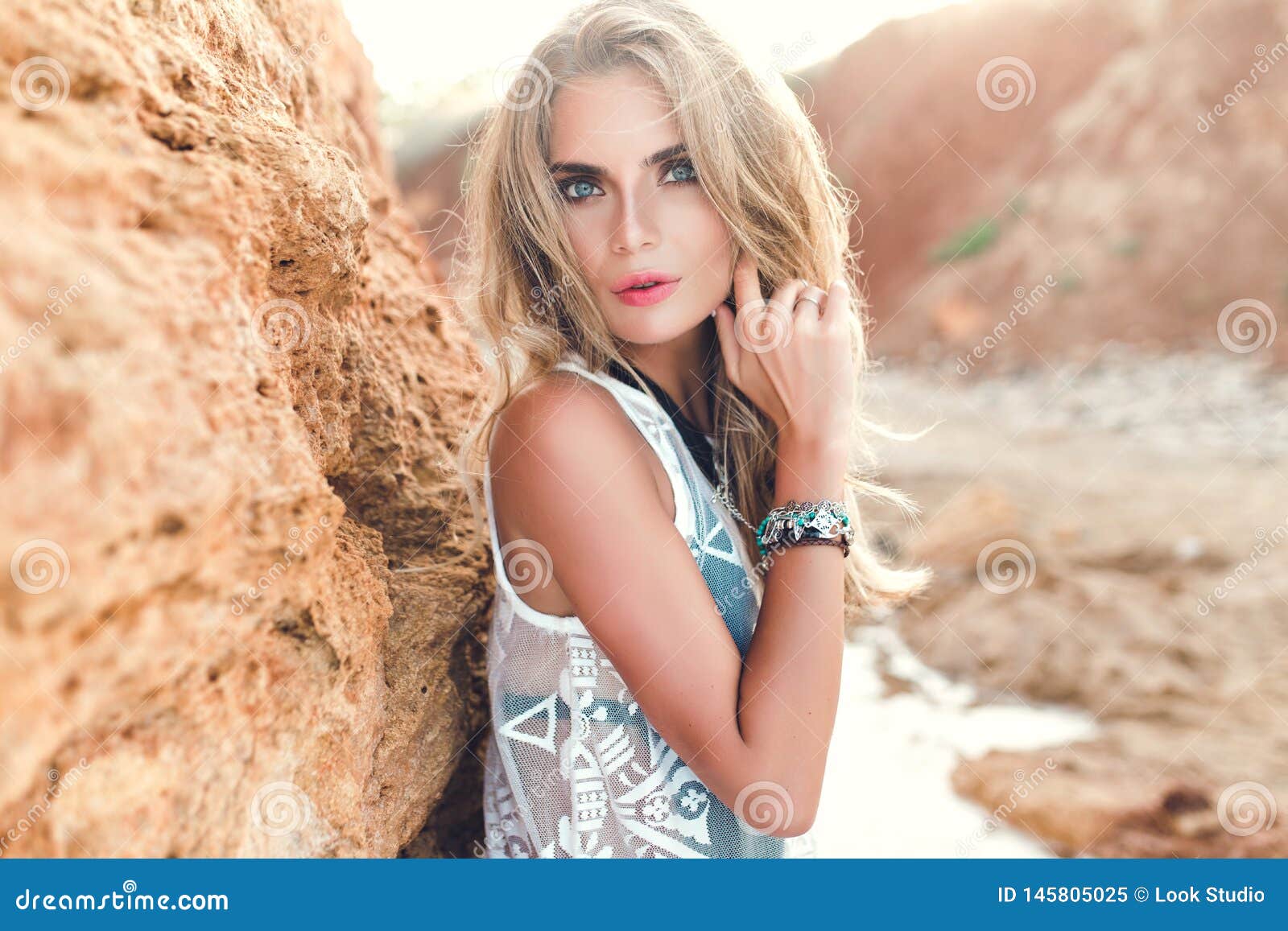 Closeup Portrait Of Blonde Girl With Long Hair Posing To The Camera On 