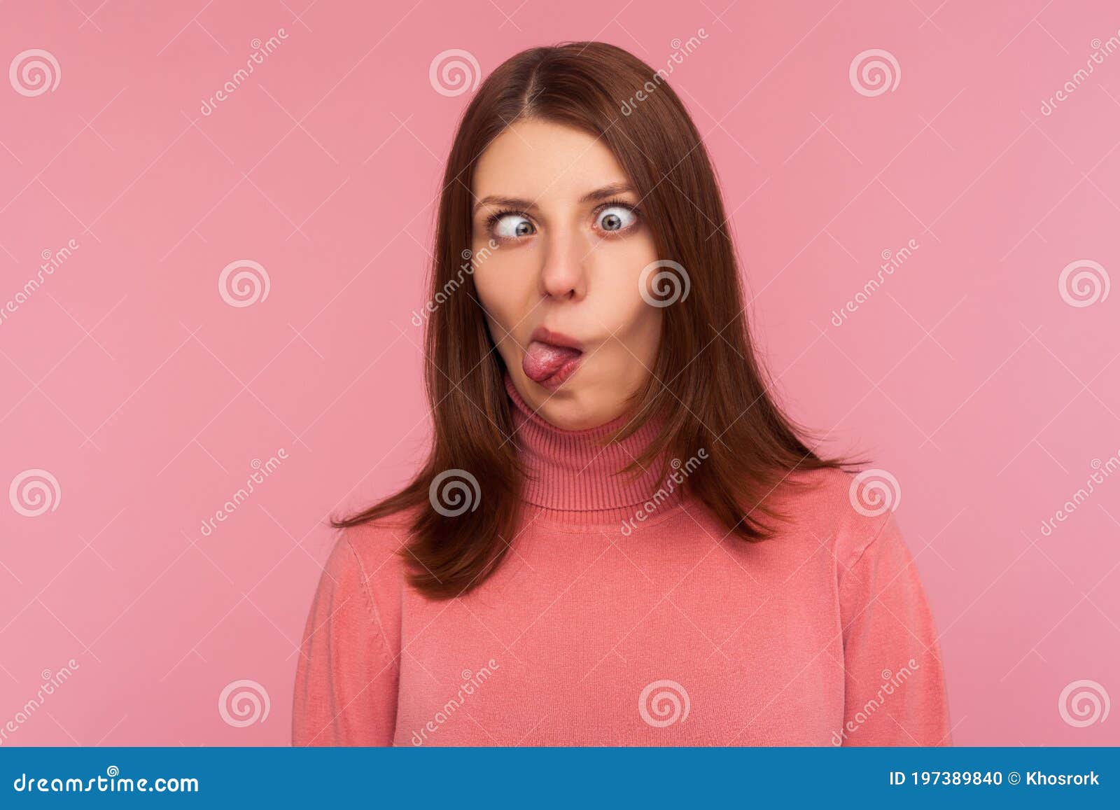 Closeup Portrait Of Funny Crazy Woman Crossing Eyes And Showing Tongue Having Fun Making Dumb 