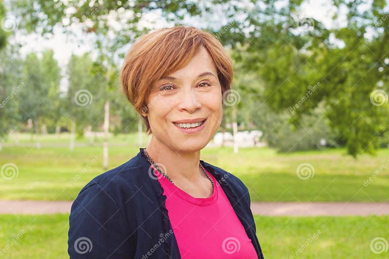 Closeup Portrait Of Healthy Smiling Older Woman Outdoors Elegant Mature Redhead Woman With