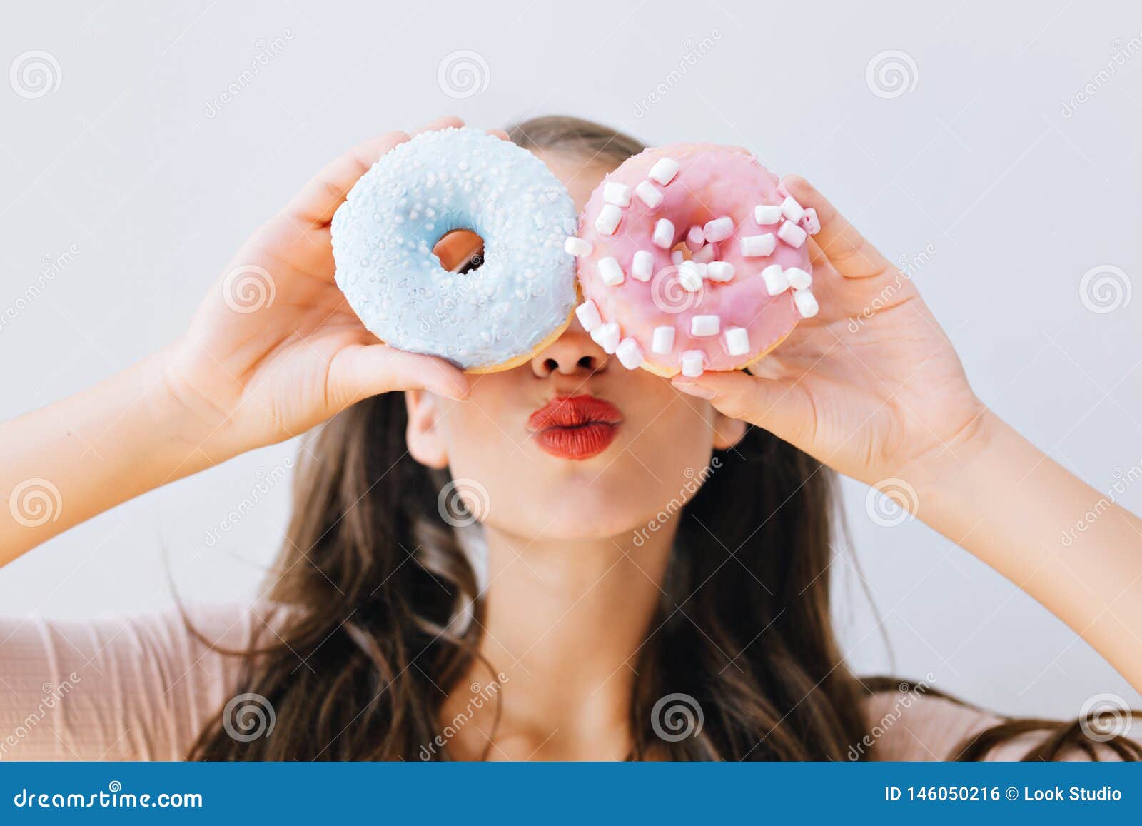 Closeup Portrait Joyful Girl With Red Lips Having Fun With Colorful Donuts Against Her Eyes