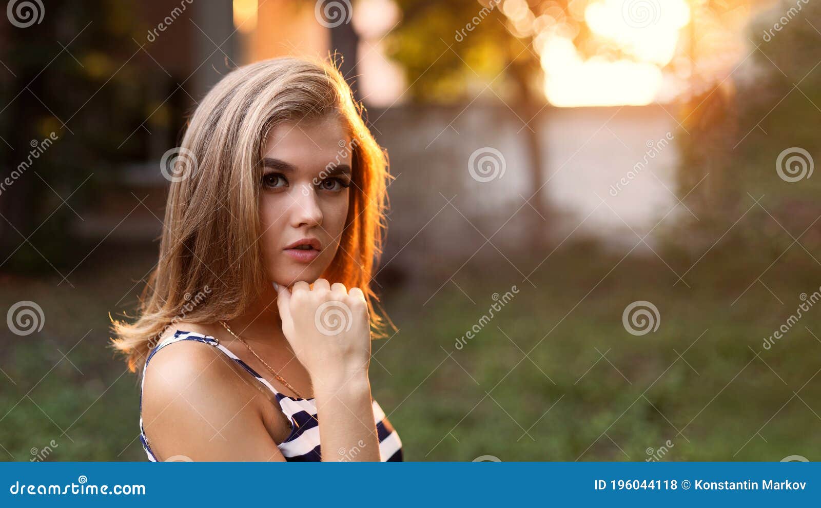 Closeup Portrait of a Young Attractive Girl in Backlight Against ...