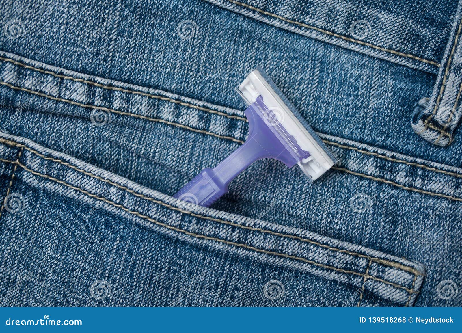 Purple Disposable Plastic Razor in Blue Jeans Pocket Stock Photo ...