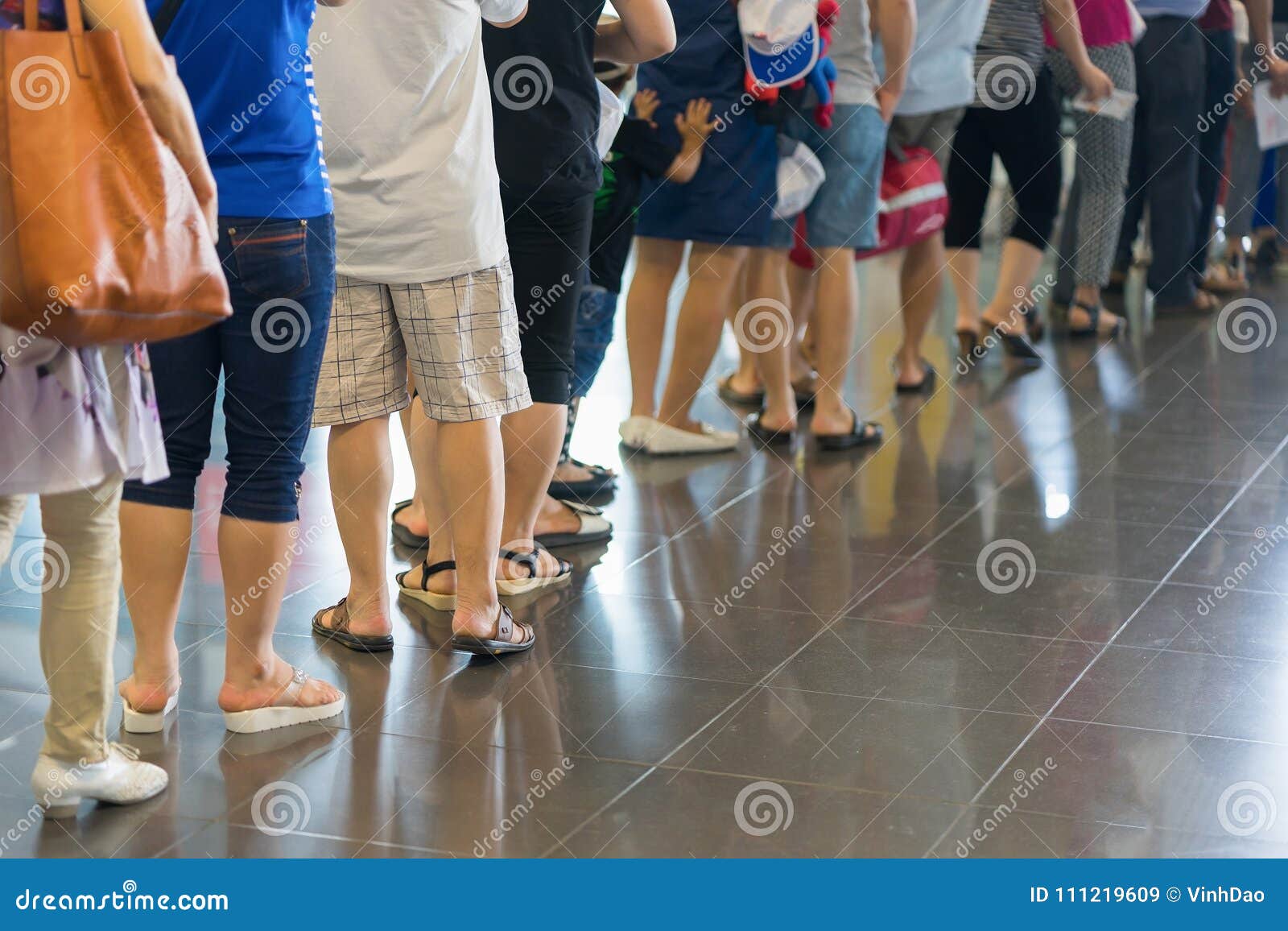 closeup queue of asian people waiting at boarding gate at airport