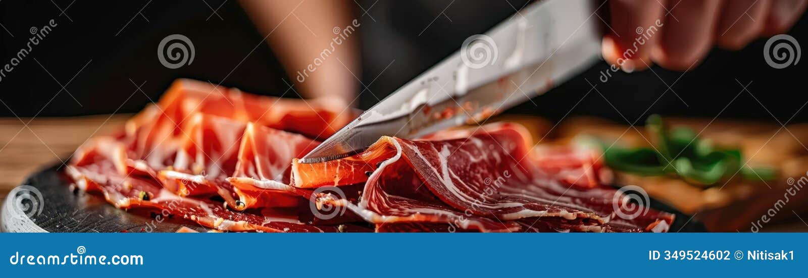 closeup raw style of jamon iberico de bellota acornfed ham slicing