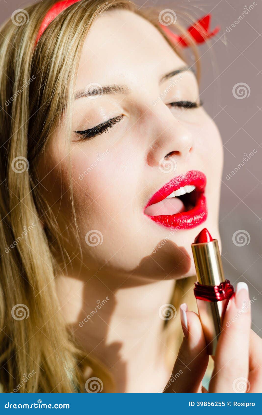Closeup on Seductive Attractive Sexual Young Blonde Pinup Woman Draws Red Lipstick Open Lips Sensually Eyes Closed Stock Image