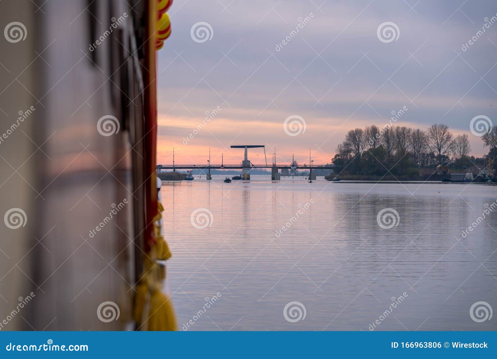 closeup selective focus shot of golden tassels hanging over a boat in elburg, netherlands