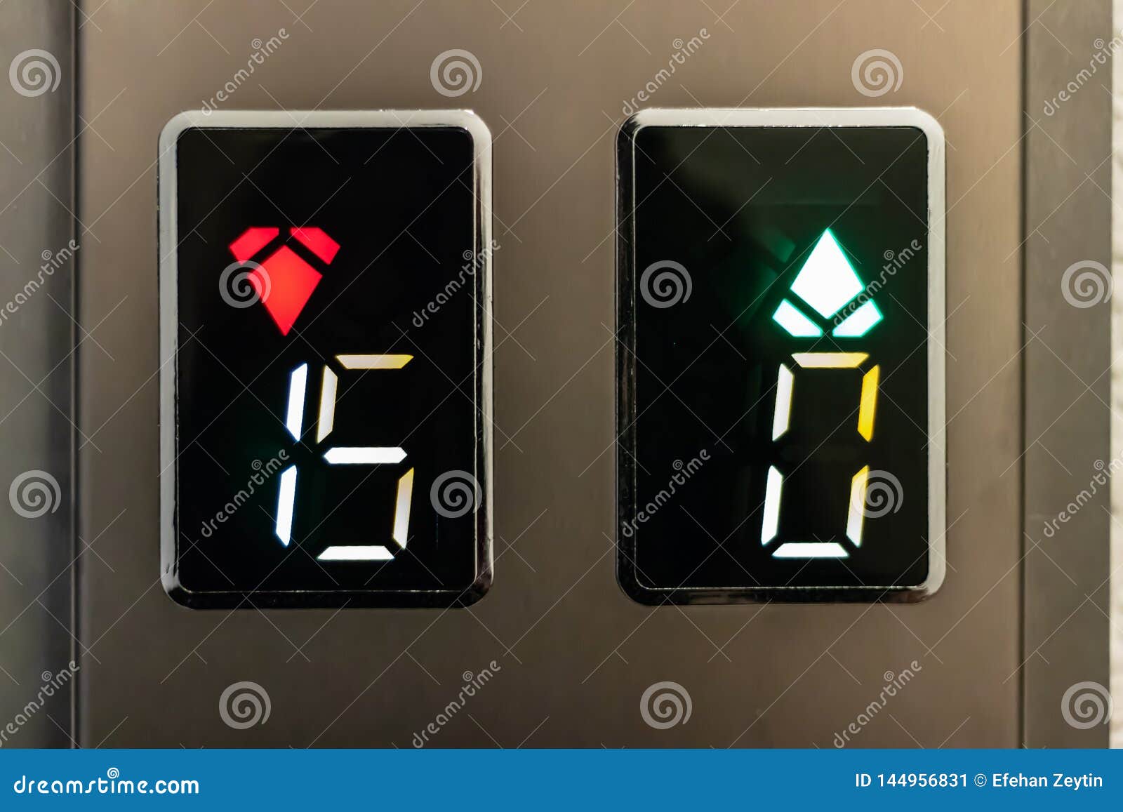 A Closeup Shoot of Elevator Signs with Up and Down Arrows and Numbers