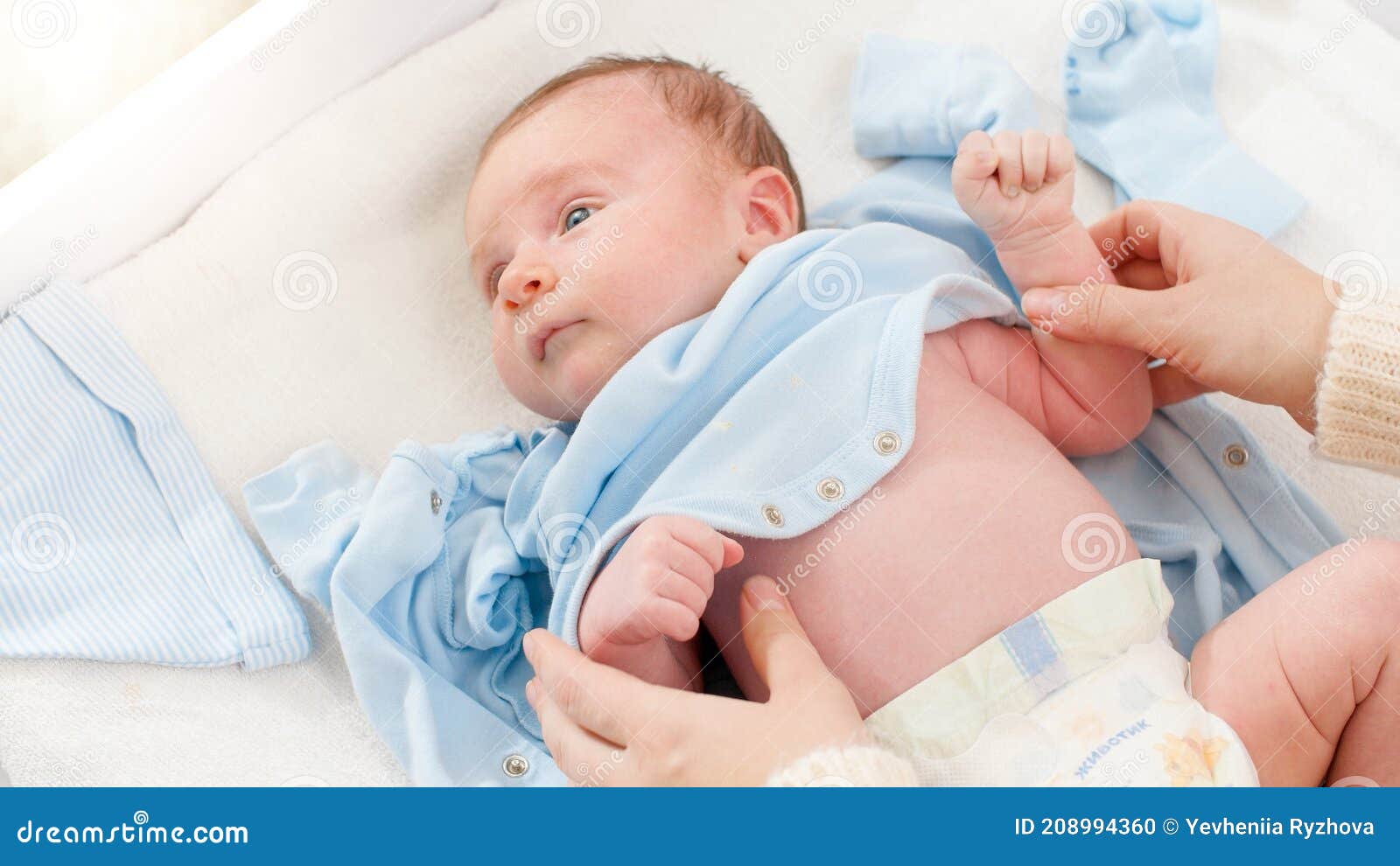 Closeup Shot Of Caring Mother Undressing Her Little 1 Months Old Baby Boy Lying On Changing Table Concept Of Babies And Stock Photo Image Of Little Infant