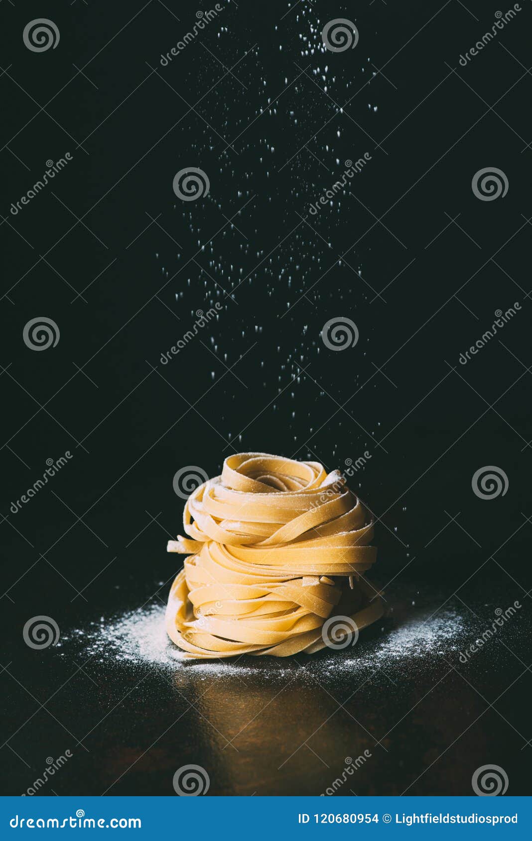Closeup Shot of Flour Falling on Tagliatelle Pasta Stock Photo Image