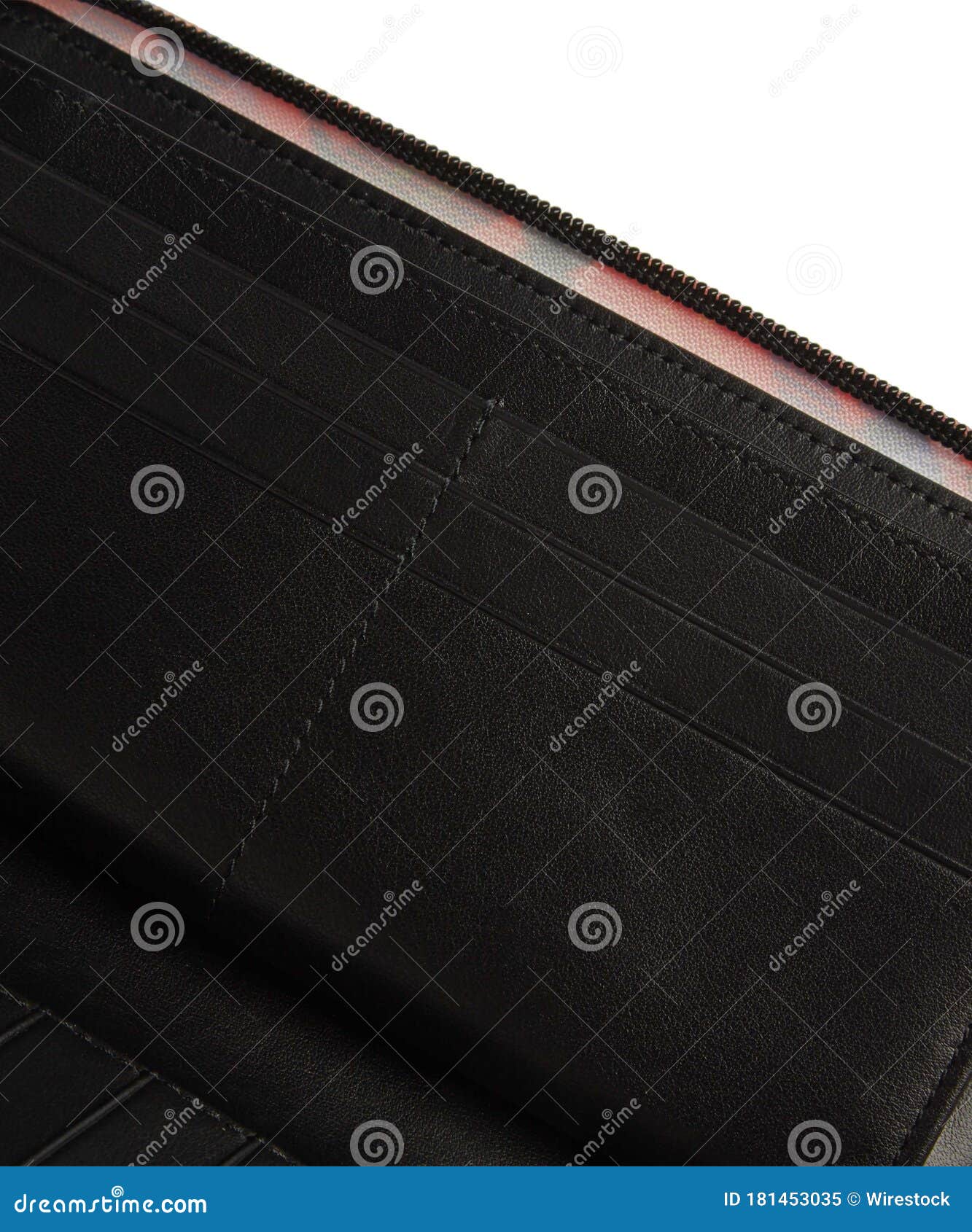A closeup shot of the inner pockets of an open black wallet