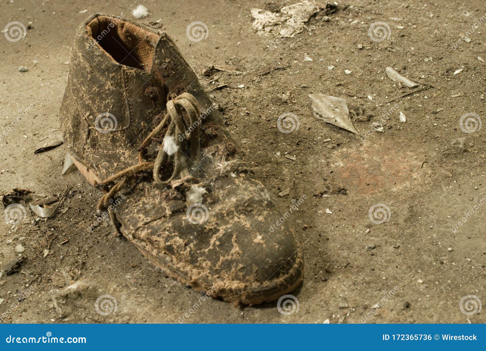 Closeup Shot of an Old Worn Out Dirty Boot on the Ground Stock Photo ...