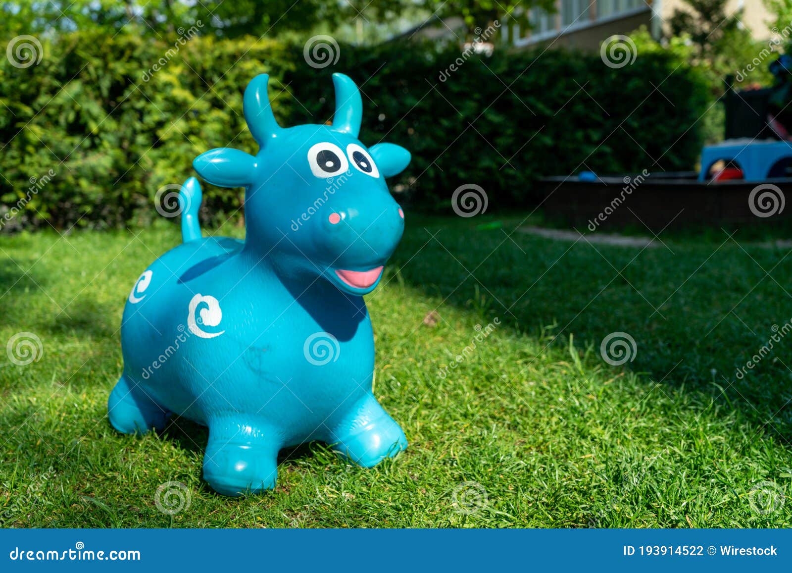 Closeup Shot of a Plastic Bull Toy in a Backyard Stock Photo Image of