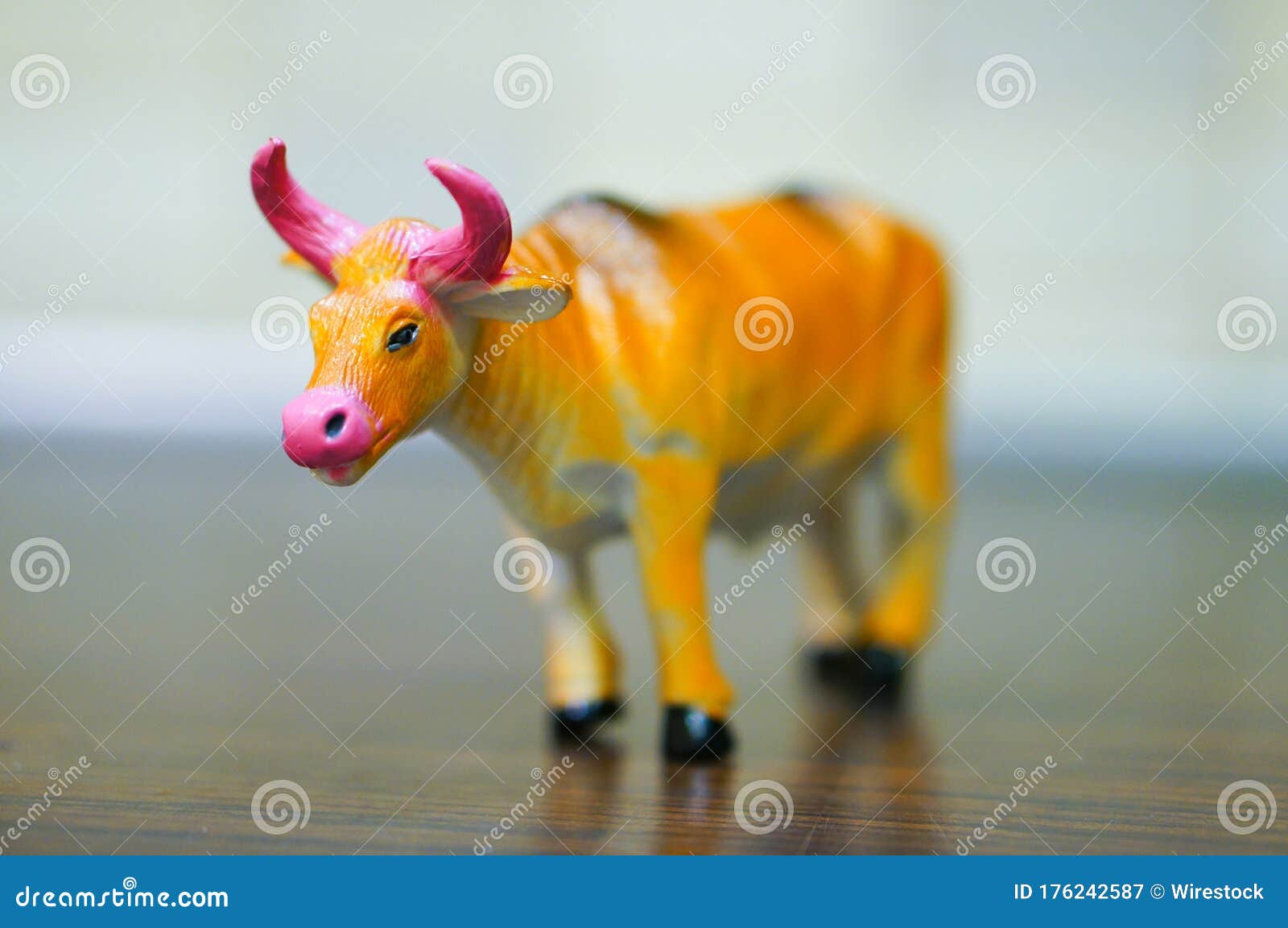 Closeup Shot of a Plastic Toy Bull on a Wooden Surface Stock Image Image of moose, landscapes